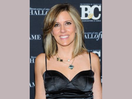 Alisyn Camerota in a black dress poses for a picture.